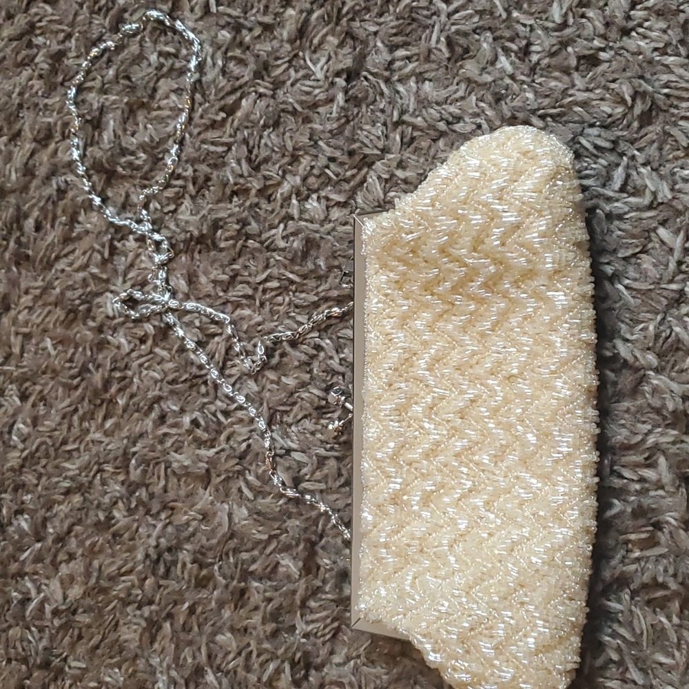 Mes Ami beaded ivory evening purse with chain strap.